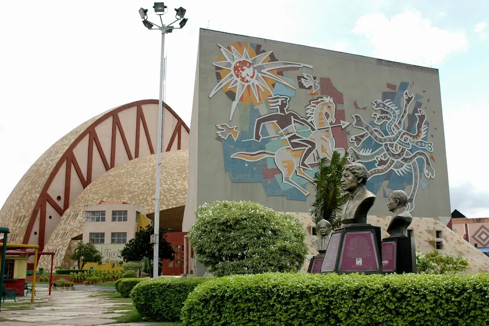 Exterior view of Science City with artistic wall and dome-shaped buildings